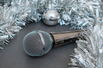 Musical microphone and silver christmas tinsel for christmas party