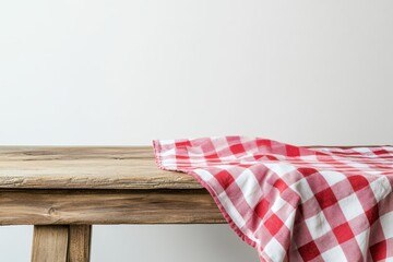 Obraz premium Rustic table setting with red and white checkered tablecloth on wooden table