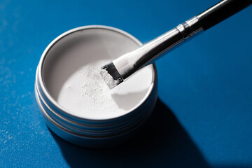 White contouring paste provides precise outline for eyebrow shaping and permanent makeup...