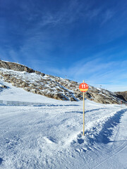 Number 11 on a wooden sign in mountains