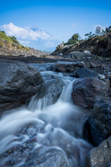 Water flow in long exposure in a small river at the foot of the Mount Semeru, Lumajang, Indonesia