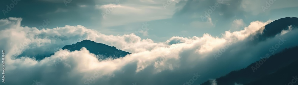 Aufkleber serene landscape featuring misty mountains enveloped in soft clouds, creating a tranquil and atmosph