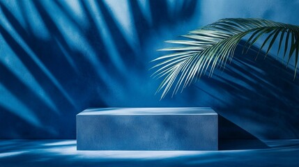 Minimalist blue podium with palm leaf shadow, tropical aesthetic for product display. Sleek concrete platform in serene aquatic atmosphere.