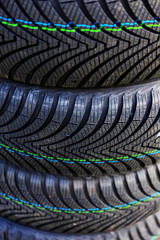 Purchasing new tires for the car and replacing them in the garage.