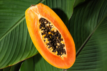 Cut half of fresh papaya fruit with vivid colors. Papaya fruit is ideal for themes of natural health and tropical lifestyle. Papaya fruit is highly used in cosmetics and beauty procedures.