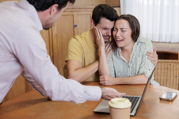 A young teacher brings parents together to explain their child's situation at school. Some parents are very upset and cry with the bad news that the teacher is telling them.