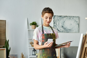 At home, a young woman mixes colors and captures inspiration while painting her latest creation.