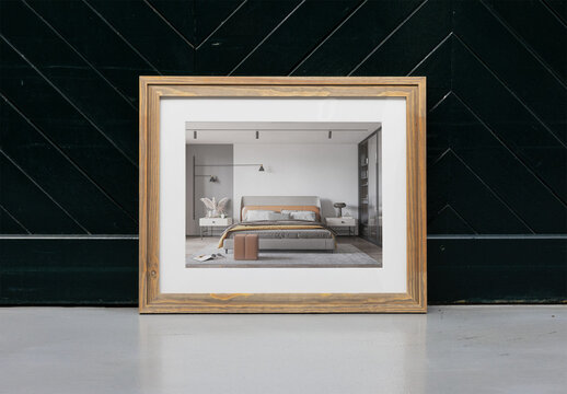 Empty Wooden Frame Leaning Against a Dark Geometric Wall. Front view
