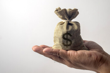 Burlap sack with big dollar symbol on white background