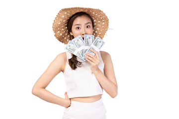 Young woman holding cash while wearing a straw hat, expressing joy and excitement.