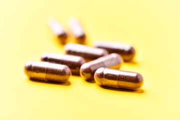 Lutein capsules. Dietary supplement on bright background. Soft focus. Close up. Copy space.	