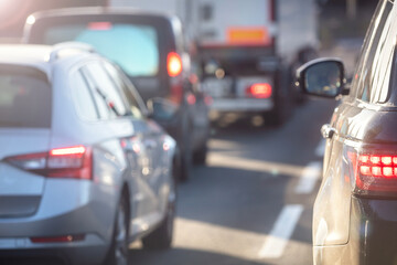 Traffic jam congestion with rows of cars on highway or motorway in rush hour