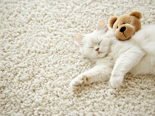 A fluffy white cat peacefully sleeps with a teddy bear on a soft carpet.