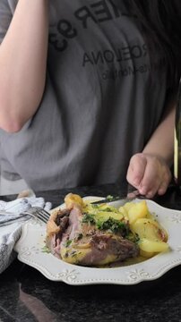 Roasted Duck Leg with Potatoes and Herbs Gourmet OvenbBaked Dish. elicious video of a duck leg being prepared,potatoes and aromatic herbs, roasted to in the oven.for food blogs,tutorials,media content