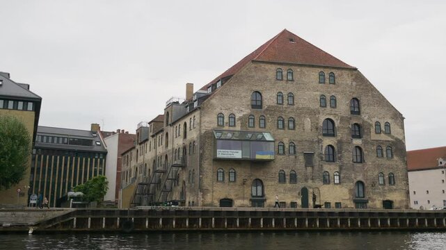 Street view of the Gammel Dok former warehouse on the waterfront of the Inner Harbour in the Christianshavn neighbourhood of Copenhagen, Denmark