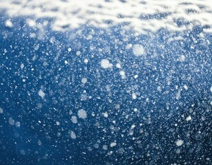 Obraz premium winter snowfall texture closeup macro background, photo of snow falling with selective blur effect
