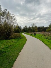 Pathway through a nature walk on a cloudy day in England 