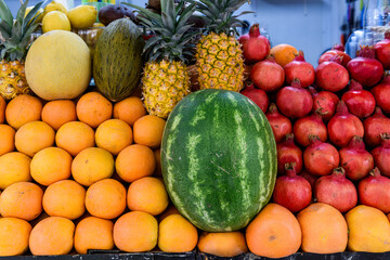 Variety of fuits including watermelon, pineapple, melon grapefruit, pomegranate and sefardi melon...
