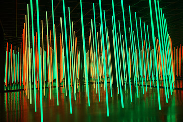 Colorful LED lights in infinity mirror room. The mirror maze is illuminated with bright multi-colored lights.  