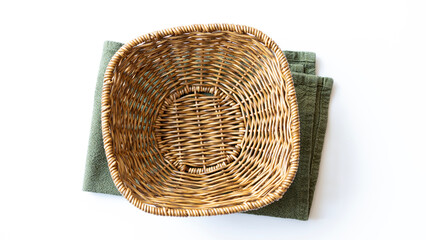 Fototapeta premium Empty wicker basket on a white background. Top view.