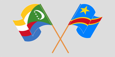 Obraz premium Crossed and waving flags of the Comoros and Democratic Republic of the Congo. Vector illustration