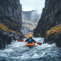 Kayaker Navigating a Rocky, Foamy River Gorge