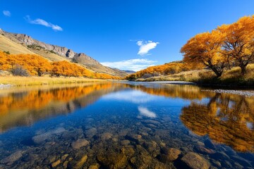 Fototapeta premium Landscape of a calm river flowing through a valley, with reflections of trees and hills on the water