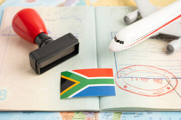Approved Stamp visa and passport with South Africa flag document to immigration at airport in...