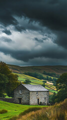 A single-story stone house sits on a grassy hillside with rolling hills in the background and dramatic storm clouds overhead.