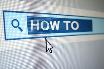 Mouse cursor hovering over how to search bar on computer screen