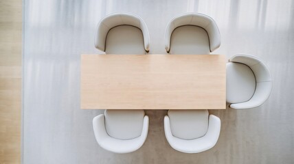 Minimalist Meeting Room with Wooden Table and Cushioned Chairs

