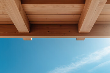 wooden ceiling against a blue sky with clouds, wooden construction concept