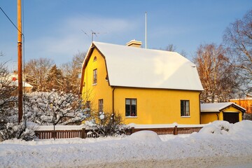 Swedish village houses on a snowy winter day in Stockholm region