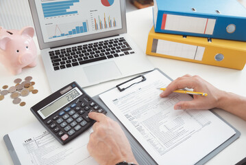 Man calculate tax income, financial concept