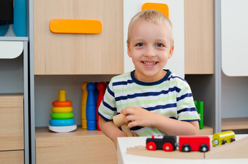 Little boy smiling, child in kindergarten