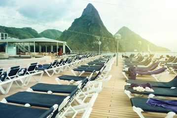 Cruise Deck with Lounge Chairs Overlooking Pitons Mountains in St. Lucia
