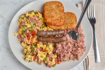 scramble eggs  with  corn beef hash and  sausages