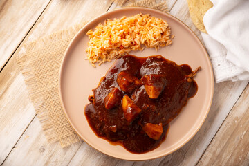 Hamburg steak, Shredded beef breaded and bathed in pasilla chile sauce, in Mexico they are called Tortitas de Carne en Pasilla. Accompanied with rice, a typical recipe of Mexican home cooking.