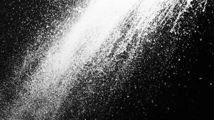 Obraz premium White powder splattered on a black background.