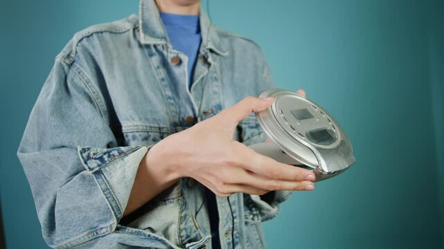 CD Player, Using headphone for old music portable compact player close-up. Listen to music with vintage player. 