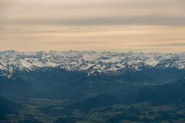 Sonthofen area with snow covered mountains seen from a small plane