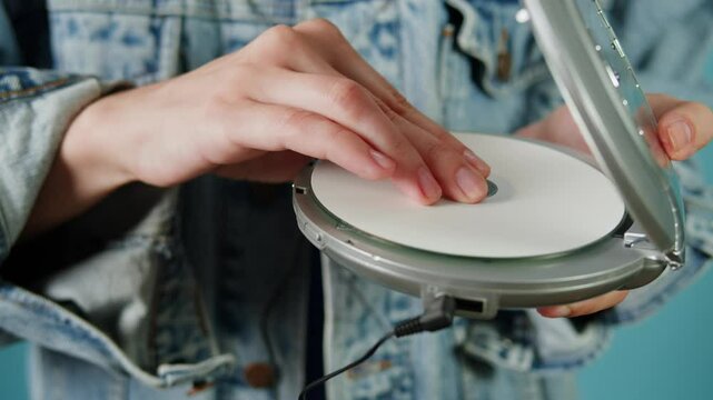 CD Player, Using headphone for old music portable compact player close-up. Listen to music with vintage player. 