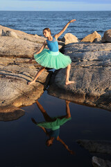 Dancer in blue by the ocean