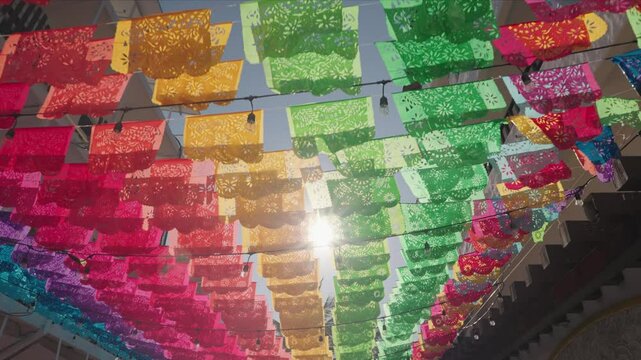 Mexican Papel Picado flags decorate Puerto Vallarta Malec&oacute;n and Church of Our Lady of Guadalupe in the Mexican state of Jalisco during Day of the Dead D&iacute;a de Muertos