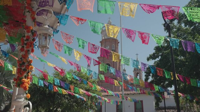 Mexican Papel Picado flags decorate The Altar de Muertos for the Day of the Dead (D&iacute;a de Muertos) celebration in Puerto Vallarta, Mexico.