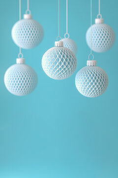 Blue and white textured Christmas boubles isolated against a light teal background, offering a modern and minimalist holiday aesthetic with copy space.