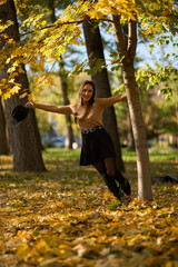 Latin lady in a colorful park in the autumn