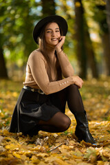 Latin lady in a colorful park in the autumn