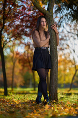 Latin lady in a colorful park in the autumn