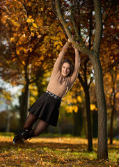 Latin lady in a colorful park in the autumn